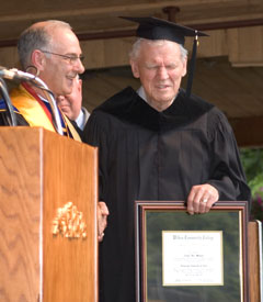 Photo of Doc Watson receiving honorary degree from Wilkes Community College